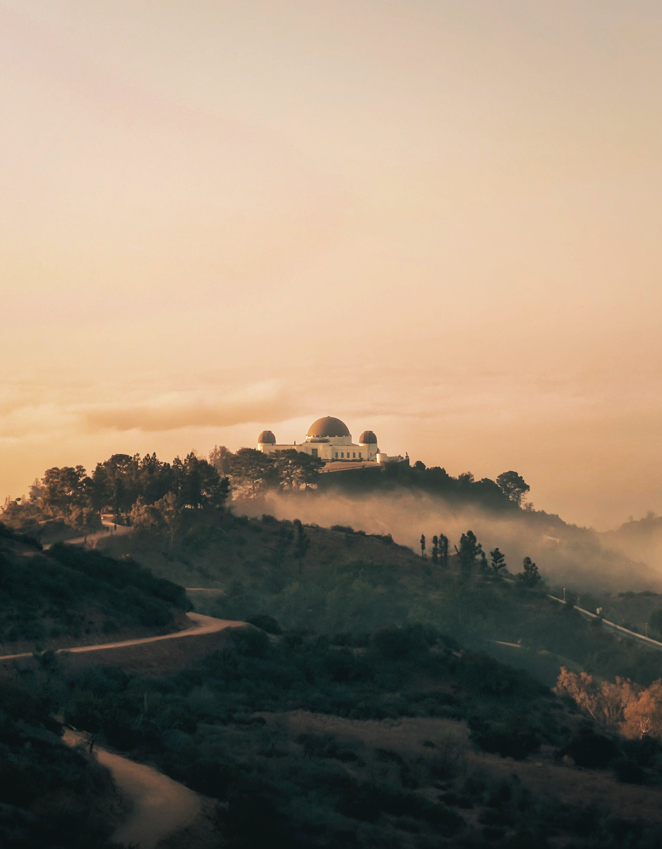 white concrete building on top of mountain during daytime